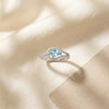 Teardrop Blue CZ Halo Silver Ring